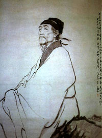Head of a Chinese man with a goatee, a mustache, and black headwear