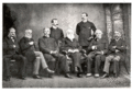 1885 - Seen sitting on the far left with the founding members of the American Historical Association