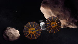 Artist's conception of Lucy spacecraft flying past the Trojan asteroid 617 Patroclus and its binary companion Menoetius. Lucy will be the first mission to explore Jupiter's Trojan asteroids – ancient remnants of the outer solar system.
