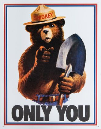 Drawing of a grizzly bear with human features. He is wearing blue jeans with a belt and a brimmed hat with the name "Smokey" on the cap, and has a shovel in his left hand. He is pointing to the viewer while the text "Only You" is seen below him.