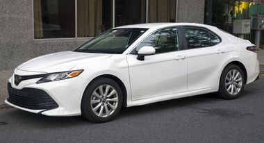 2019 Toyota Camry LE in white, front left.jpg