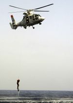 Moroccan HH-65A Dolphin helicopter. dropping a search and rescue swimmer.jpg