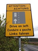 Sign reminding motorists to drive on the left in Ireland.