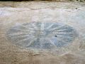 The Vergina Sun floor mosaic found in the archeological site of Titani, Thesprotia, Greece.