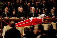 Bush, along with George W. Bush, Laura Bush, Bill Clinton, Condoleezza Rice, and Andrew Card pay their respects to Pope John Paul II before the pope's funeral, 2005