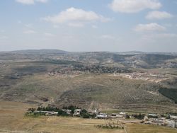 Views from Herodion (Herodyon, Herodium) - Tekoa, behind Tekoa on the right is Khirbet al-Deir and in the center left is Tuqu '.