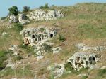 Rock caves on a hillside.