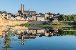A view of the prefecture of the Nièvre department, the city of Nevers, on the river Loire, with Nevers Cathedral in the background