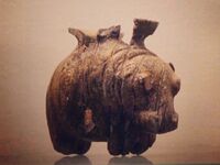 Vase in the shape of a hippopotamus. Early Predynastic, Badarian. 5th millennium BCE. From Mostagedda. This vessel is carved from elephant ivory. The fine modeling and attention to detail show the skill in achieving these pieces.