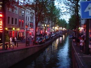 The red-light district in Amsterdam (2003). Red is the sex industry's preferred color in many cultures, due to being strongly associated with passion, love and sexuality.[4]:39–63