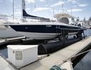 A floating drydock (or boat lift) in a private marina, used to keep small boats out of the water while not in use.