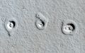 Rootless cones on Mars – due to lava flows interacting with water (MRO, January 4, 2013) (21°57′54″N 197°48′25″E﻿ / ﻿21.965°N 197.807°E﻿ / 21.965; 197.807).