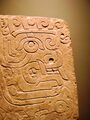 Chavín stela depicting a brindle face. National Museum Chavín de Huantar.