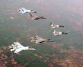 Two IAF Sukhoi Su-30 MK (rear) and two IAF Mirage 2000 fly with two USAF F-15 (middle of V-formation) during Cope India'04.