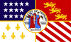 Quartered flag. Top left: blue with 17 white stars. Top right: Red with 3 golden lions. Bottom left: White with 5 gold fleur-de-lis. Bottom right: 13 alternating white and red stripes, diagonally downward. Center is covered by the city seal in color