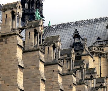 The massive buttresses which counter the outward thrust from the rib vaults of the nave.