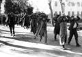 With their hands on their heads, some of the Egyptian police are escorted by British troops, from the police stations at El-Hamada and Tel-El-Kebir, to the local railway station in El-Hamada, Jan. 16, 1952. The British army were trying to capture guerrillas who had been sniping at British troops. (AP Photo)