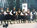Bulgarians in national dress dancing choro.