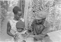 PAIGC soldier with his family in a military camp, Guinea-Bissau, 1974