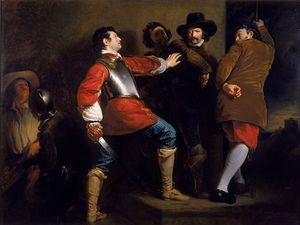 In a stone-walled room, several armed men physically restrain another man, who is drawing his sword.