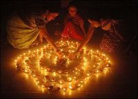 Homes, buildings and temples are decorated with festive lights, diya, for Diwali, a major festival of India.[4]