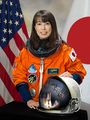 Japanese scientist and astronaut Naoko Yamazaki worked aboard the U.S. Space Shuttle. Orange suits have the highest visibility in space, or against blue sea.