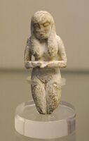 Ancient Badarian mortuary figurine of a woman, held at the British Museum