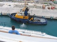 Tugboat Pelican II in Barbados flag colors; Bridgetown, Barbados. Taken aboard the cruise ship m/s Carnival Destiny.