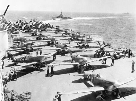 Royal Navy Fleet Air Arm Avengers, Seafires and Fireflies on إتش‌إم‌إس Implacable warm up their engines before taking off.