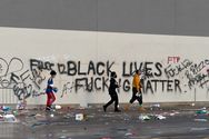 "Black Lives Fucking Matter" and "Fuck 12" graffiti on a looted Target store in Lake Street, Minneapolis, the morning of May 28, 2020