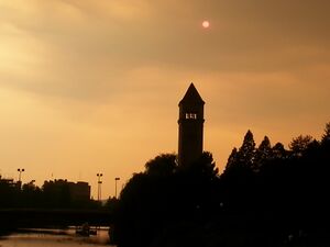 The Great Northern clocktower seen amidst an orange haze from wildfire smoke and Rayleigh scattering