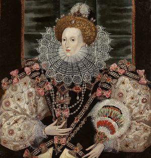 A three-quarter portrait of a middle-aged woman wearing a tiara, bodice, puffed-out sleeves, and a lace ruff. The outfit is heavily decorated with patterns and jewels. Her face is pale, her hair light brown. The backdrop is mostly black.