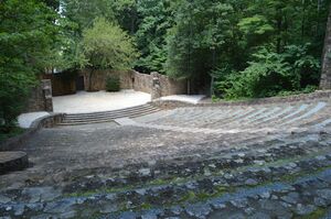 A stone amphitheater in the wooden location.