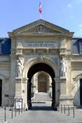 Pair of caryatids at the entrance of the Conservatoire national des arts et métiers in Paris