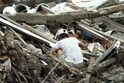 Man searching through rubble in Meulaboh after 2004 tsunami DM-SD-06-11957.JPEG