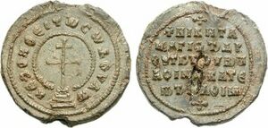 Lead seal with cross surrounded by legend on the obverse and a simple legend in the reverse