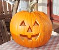 A jack-o-lantern, or pumpkin carved for Halloween.