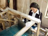 Uyghur carpet maker في خوتان