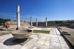 Ruins of a building with columns.