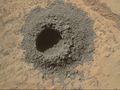 "Windjana" sandstone on Mars - drill hole (1.6 cm (0.63 in)) made by Curiosity (Kimberley; April 29, 2014).