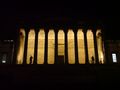 A night-time view of the UCL Main Building's portico
