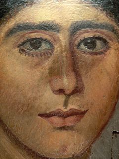 پورتريه مومياء in encaustic from Antinoopolis. The woman's hairstyle recalls portraits of Sabina, wife of the emperor Hadrian. 2nd Century. Louvre collection.