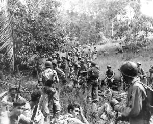 United States Marines rest in this field during the Guadalcanal campaign