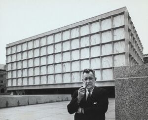 Gordon Bunshaft stands in front of the Beinecke Rare Book Library at Yale University (1963).jpg