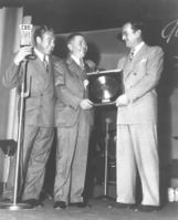 Gold record for Chattanooga Choo Choo presented to Glenn Miller (right), by W. Wallace Early of RCA Victor with announcer Paul Douglas on the left, February, 1942. In December 1944 Glenn Miller perished on a flight from London to Paris when his plane disappeared over the English Channel.
