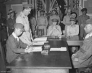 Masatane Kanda signs the instrument of surrender of Japanese forces on Bougainville Island, Papua New Guinea.