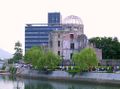Citizens of the city pass by the Hiroshima Peace Memorial on their way to a memorial ceremony on August 6, 2004