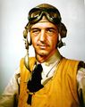 A U.S. Navy pilot during World War II wearing an orange inflatable life vest.