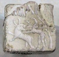 Fighting scene between a beast and a man with horns, hooves and a tail, who has been compared to the Mesopotamian bull-man Enkidu.[38][39][40] Indus Valley Civilisation seal.