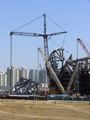 The erection of the Beijing 2008 National Stadium is extraordinarily complex. The interlaced steel construction is assembled in modules on the ground and then craned into place, like a three dimensional jigsaw puzzle. The architects are Swiss firm Herzog and de Meuron.